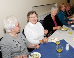 Ladies enjoying some delicious deserts after the service.